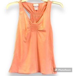 Tank top Junior racer back and cinched back and front. In pre owned condition.